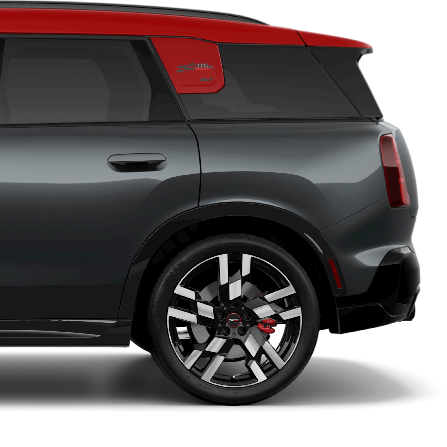 Side view of the rear of a 2025 MINI JCW Countryman ALL4 in Legend Grey, parked on a blank white surface with its shadow underneath it and nothing in the background.