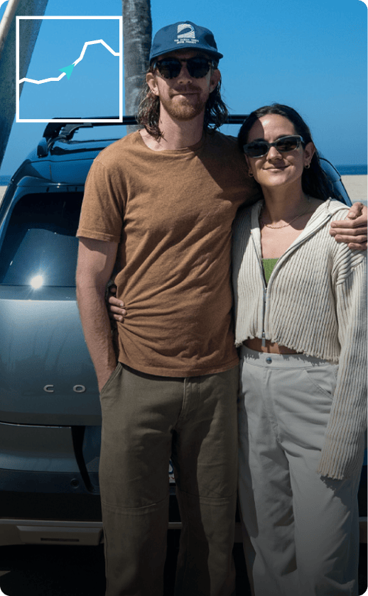 Lauren Bush and company lean on trunk of a MINI Countryman SE ALL4 with lush foliage in the background. 