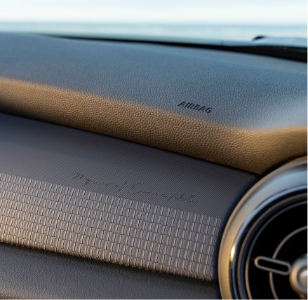 Closeup view of the dashboard inside a MINI Cooper S Convertible Seaside Edition.