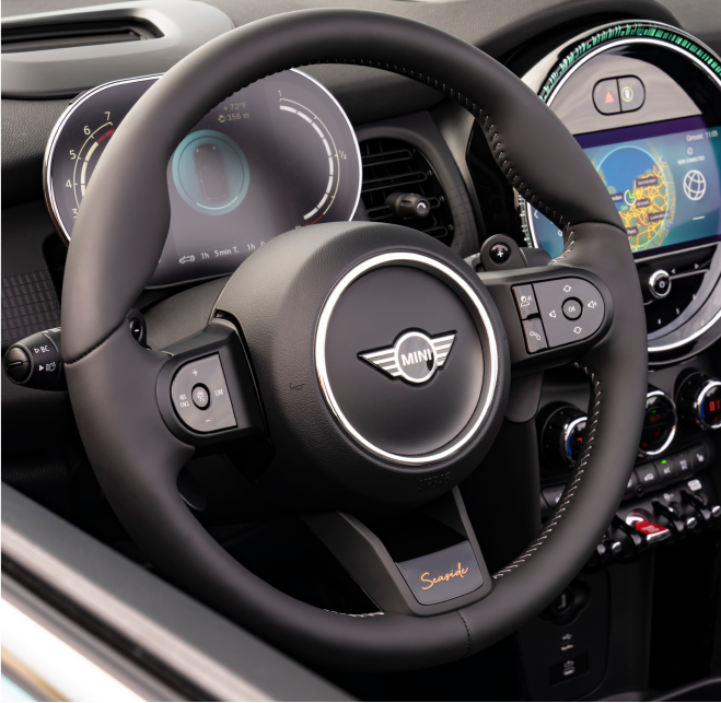 Closeup view of the heated multi-function steering wheel in a MINI Cooper S Convertible Seaside Edition.