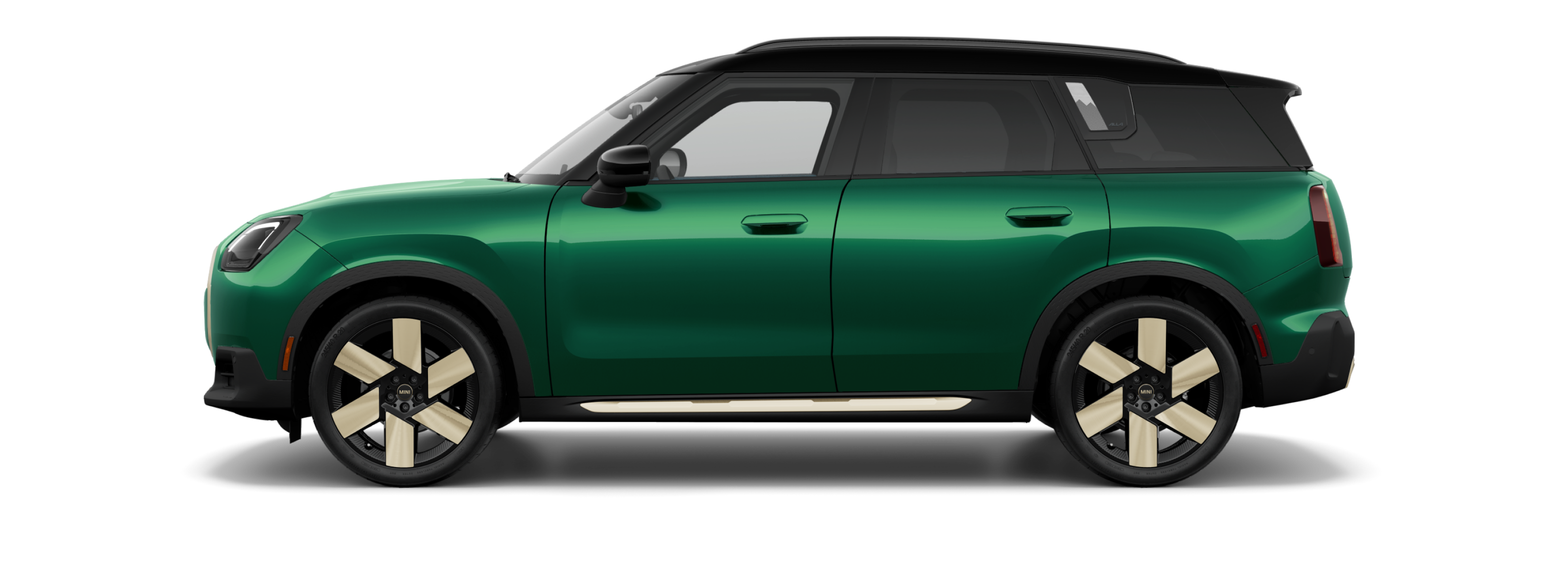 Side view of a 2025 MINI Countryman S ALL4 in the British Racing Green IV body color, facing left with its shadow underneath it.