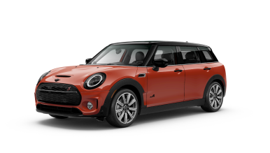 Three-quarters front view of a red MINI Clubman parked on a blank surface with its shadow underneath and nothing surrounding it.