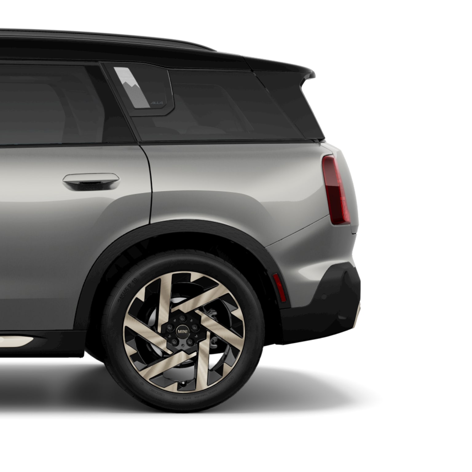 Side view of the rear of a 2025 MINI Countryman S ALL4 in Metallic Silver III, parked on a blank white surface with its shadow underneath it and nothing in the background.