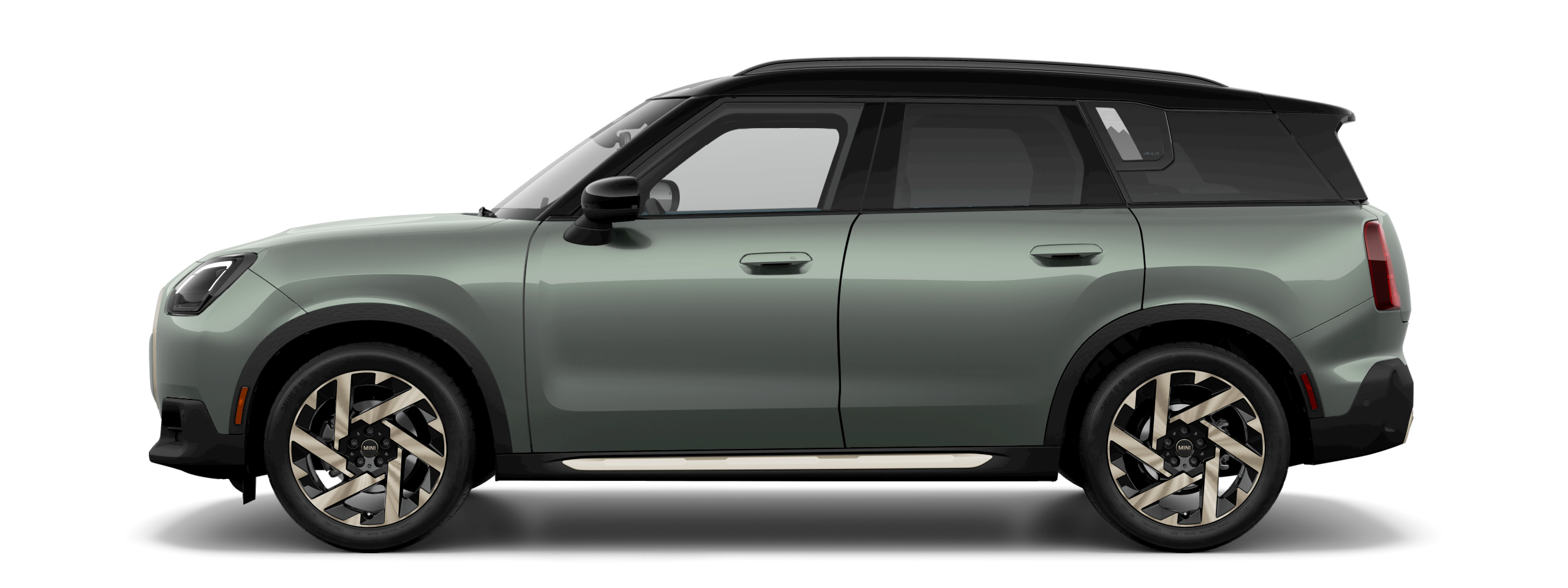 Side view of a 2025 MINI Countryman S in the Smokey Green body color, facing left with its shadow underneath it.