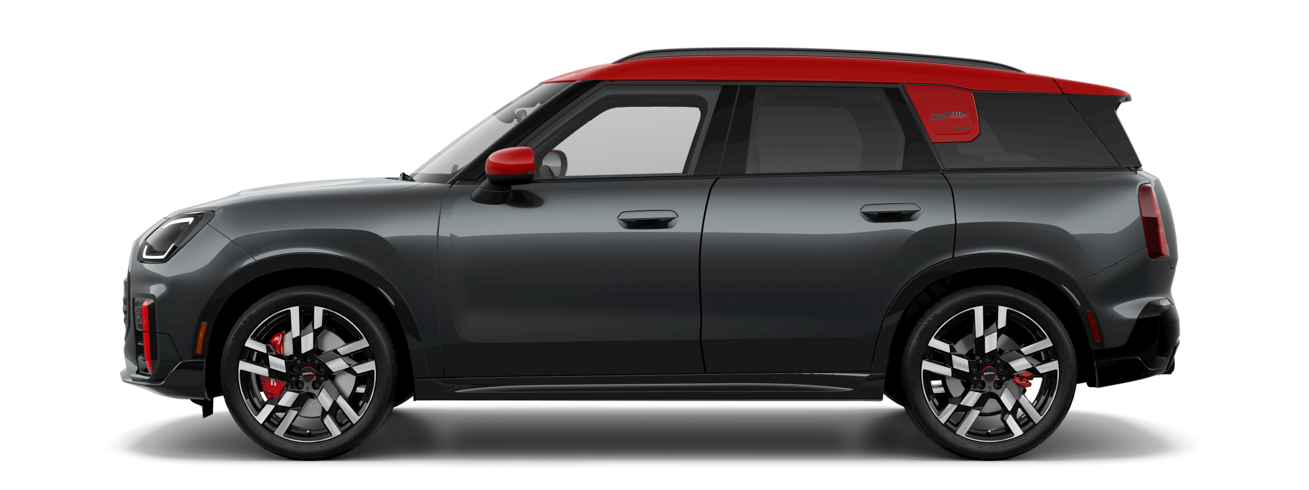 Side view of a 2025 MINI JCW Countryman ALL4 in the Legend Grey body color, facing left with its shadow underneath it.