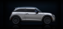 Side-view of the silhouette of a MINI with silver paint being poured over it.